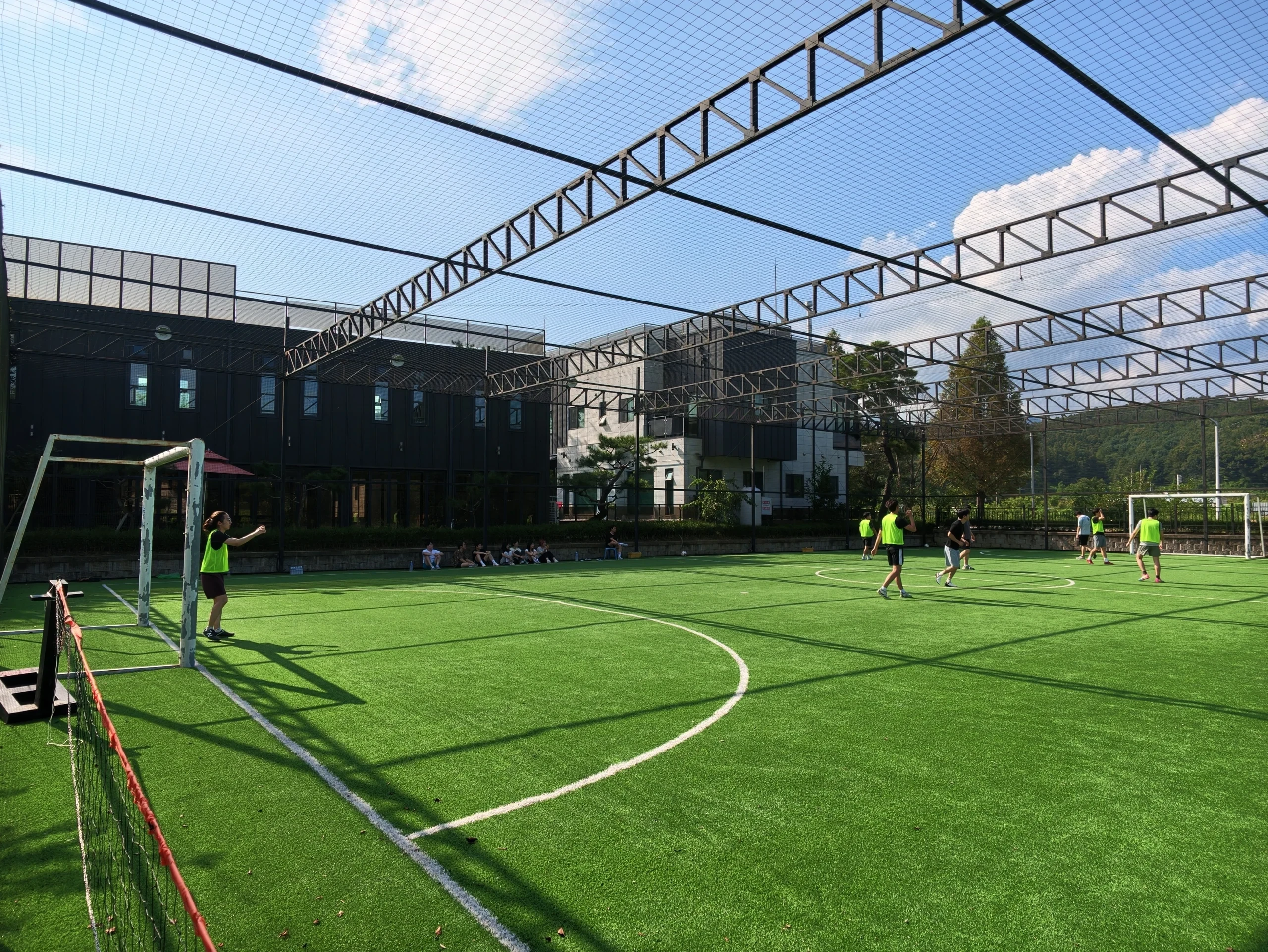 ICNL and SERA Lab members playing soccer together during their collaborative workshop