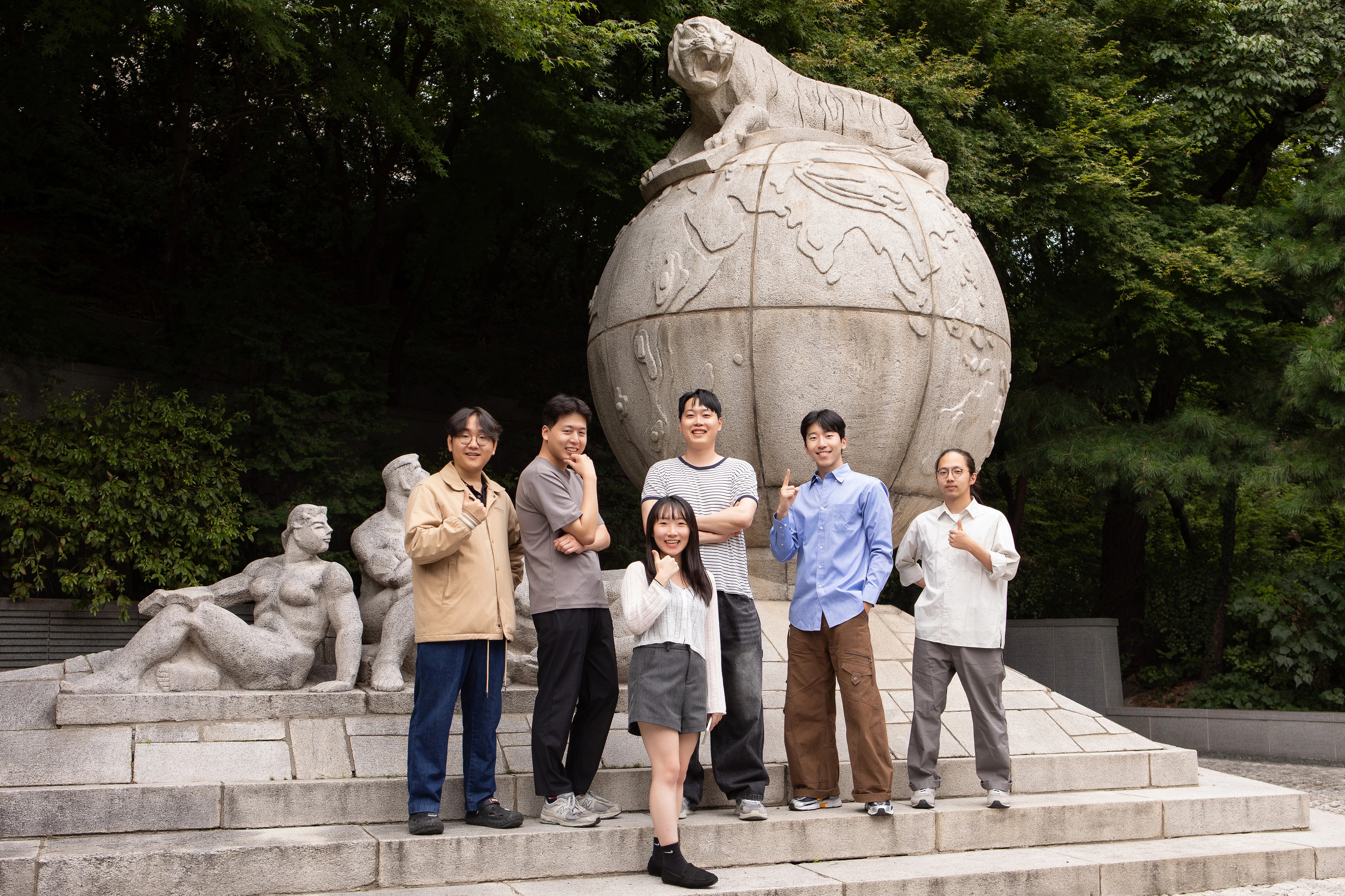 SERA Lab members posing together by the tiger statue